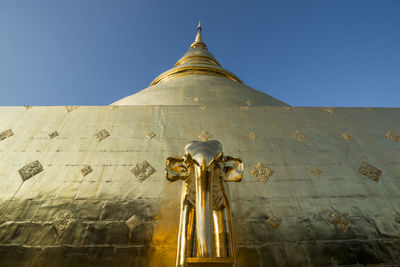 Low angle view of statue against building