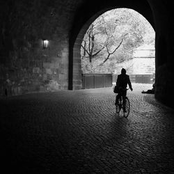 Full length of woman walking in tunnel