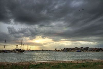 Scenic view of sea against cloudy sky