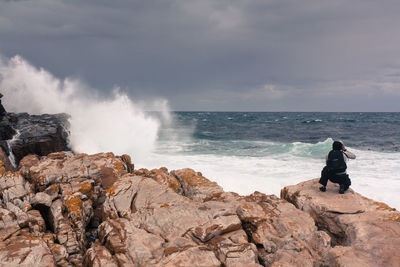 Scenic view of sea against cloudy sky