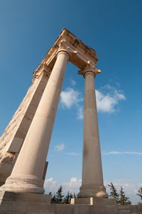 Low angle view of historical building against blue sky