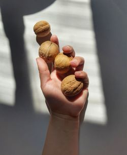 Close-up of hand holding ice cream cone