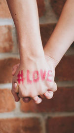 Low section of woman with hands