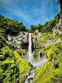 Scenic view of waterfall in forest. kegon falls, nikko, japan