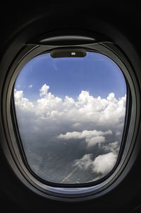 Scenic view of landscape seen through window