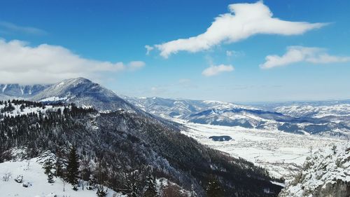 Scenic view of snowcapped mountains against sky
