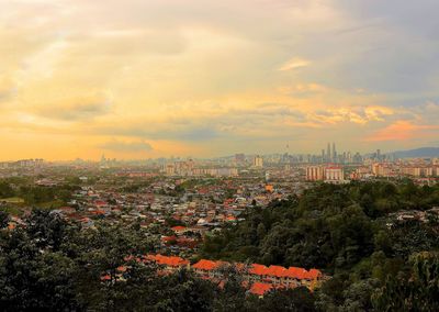 High angle view of buildings against sky during sunset