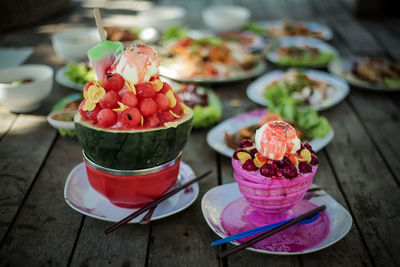 Close-up of chopped fruits in plate on table