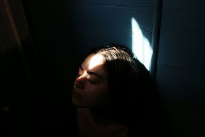 Close-up of young woman with eyes closed