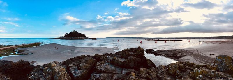 Panoramic view of sea against cloudy sky