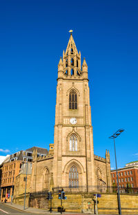 Low angle view of building against blue sky