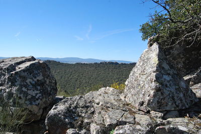 Scenic view of mountains against clear blue sky