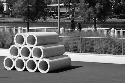 Stack of people by railing in park