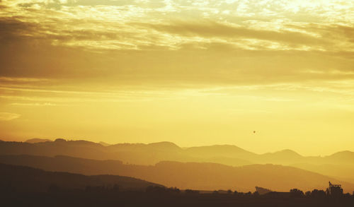 Scenic view of mountains at sunset