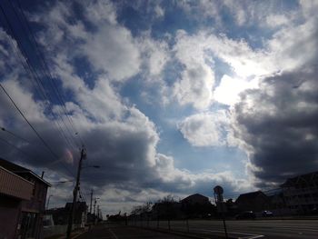 Low angle view of storm clouds over city