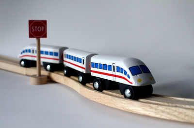 Side view of toy train over white background