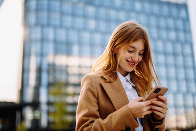 Young woman using mobile phone