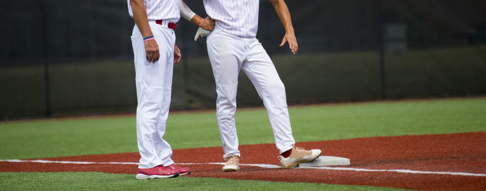 Panoramic view of baseball players standing on playing field