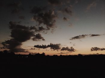 Silhouette landscape against sky during sunset