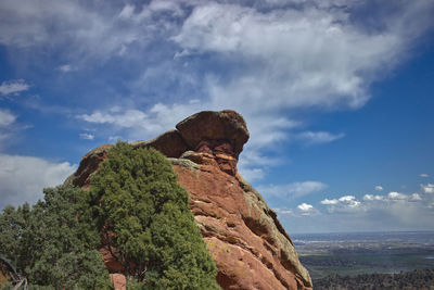 Red rock formation against sky