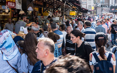 People walking on street in city
