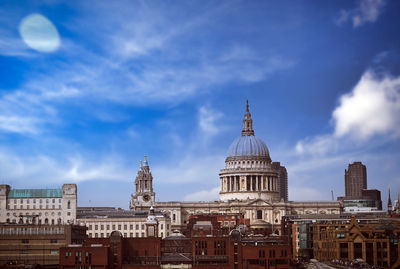 View of buildings in city against sky