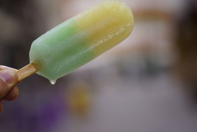 Cropped image of hand holding ice cream