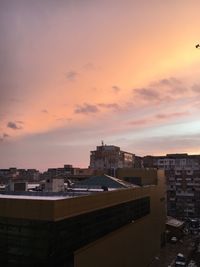 Cityscape against sky during sunset