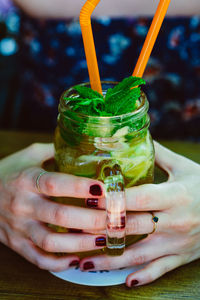 Close-up of woman holding drink