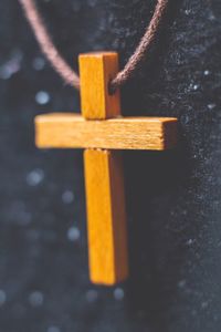 Close-up of rope tied up on wood