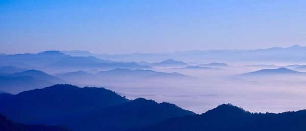 Scenic view of silhouette mountains against clear sky