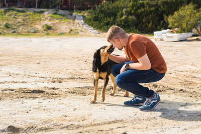 Side view of man with dog