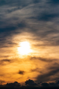 Low angle view of dramatic sky during sunset