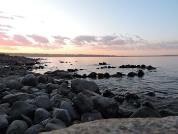 Scenic view of sea at sunset