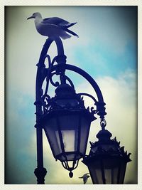 Low angle view of lamp post on street light