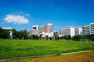 View of apartment building against blue sky