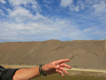 Cropped image of person holding railing