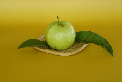 High angle view of fruit against yellow background