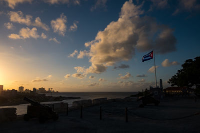 Scenic view of beach against sky during sunset