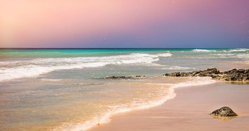 Scenic view of beach against clear sky