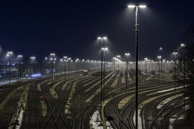 Empty railway tracks at night