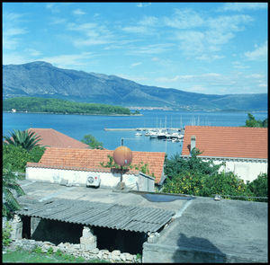 Scenic view of swimming pool against sea and mountains