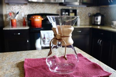 Close-up of wineglass on table at home