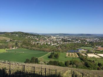 Scenic view of agricultural field against clear sky