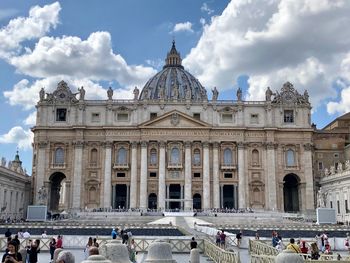 Group of people in front of historical building st peter basilica