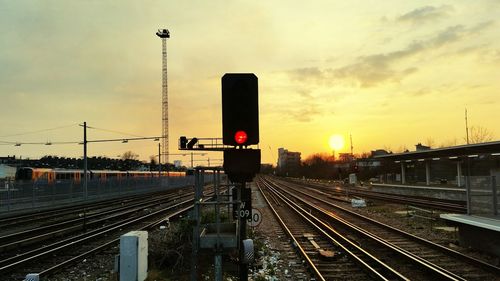 Railroad tracks and signal during dusk