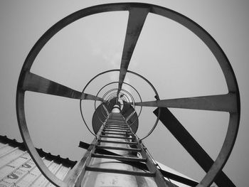 Low angle view of metallic structure against sky