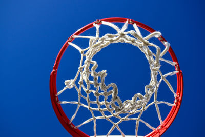 American basketball hoop against clear blue sky