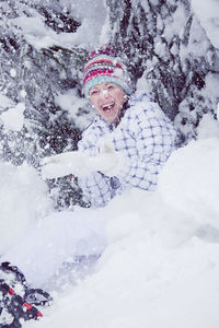 Portrait of smiling man in snow