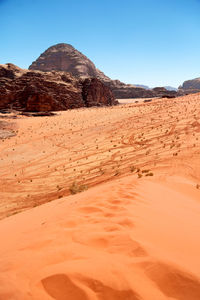 Scenic view of desert against clear sky